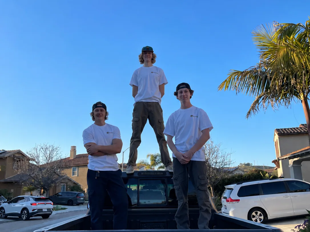 Nick, Jake and Aidan standing on the first Junk Boyz pickup truck