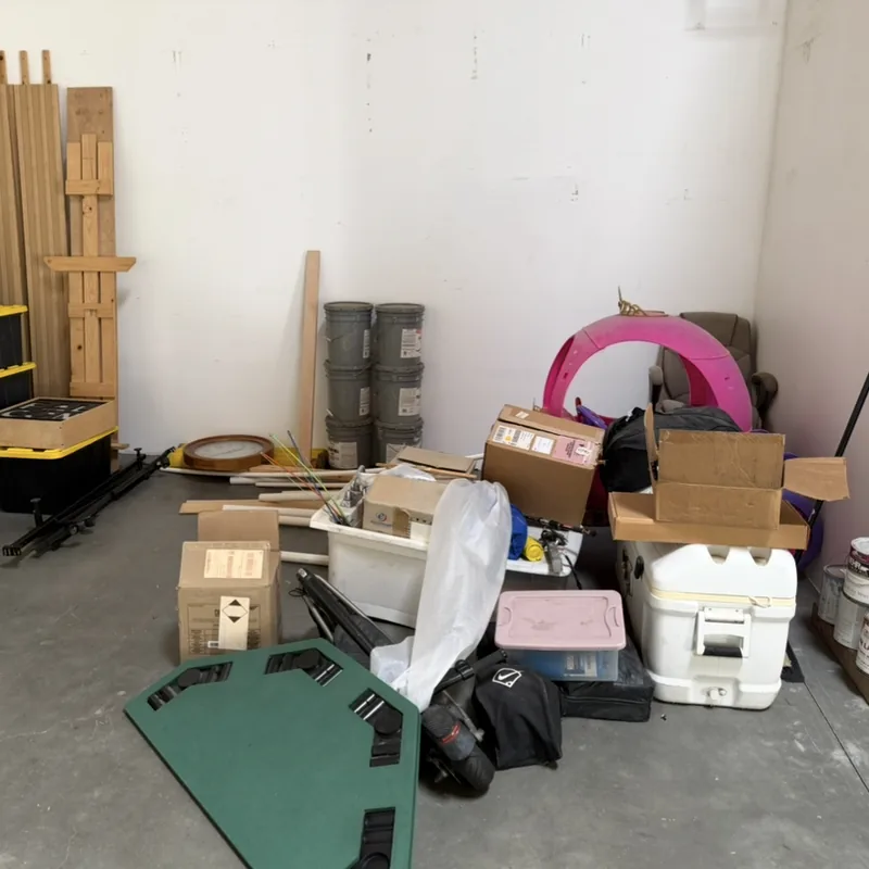 Garage corner packed with boxes, bins and leftover odds and ends